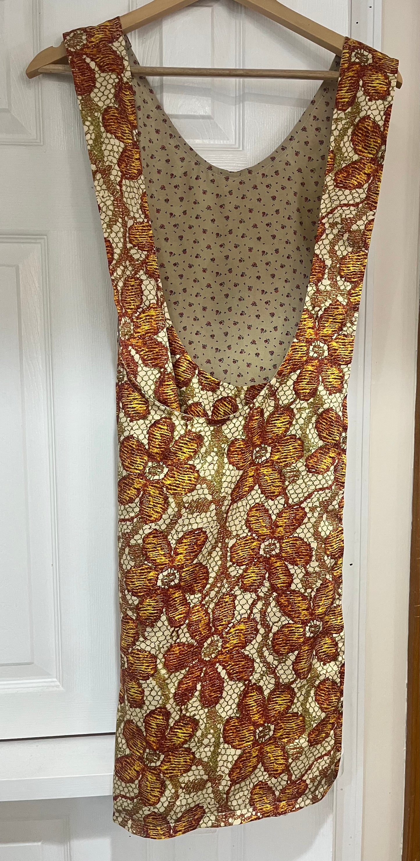 Autumn harvest tapestry bib apron - back view showing floral lining