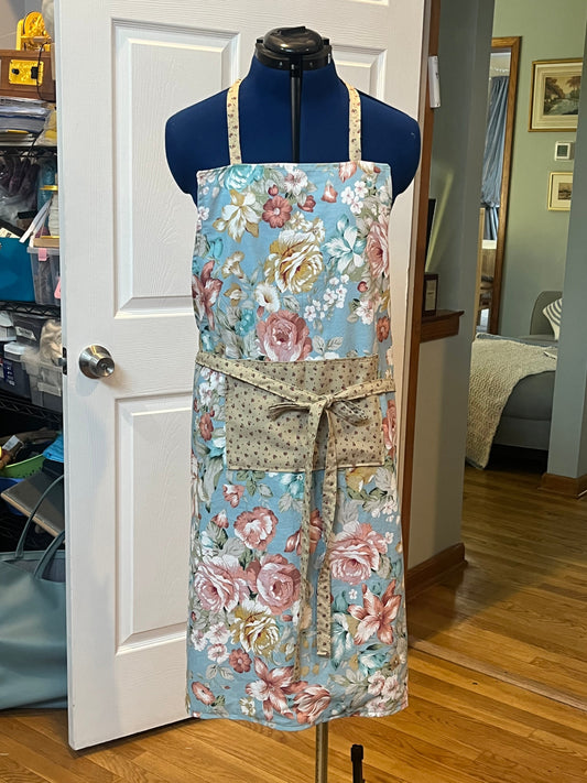 Blue rose garden bib apron - front view on dress form