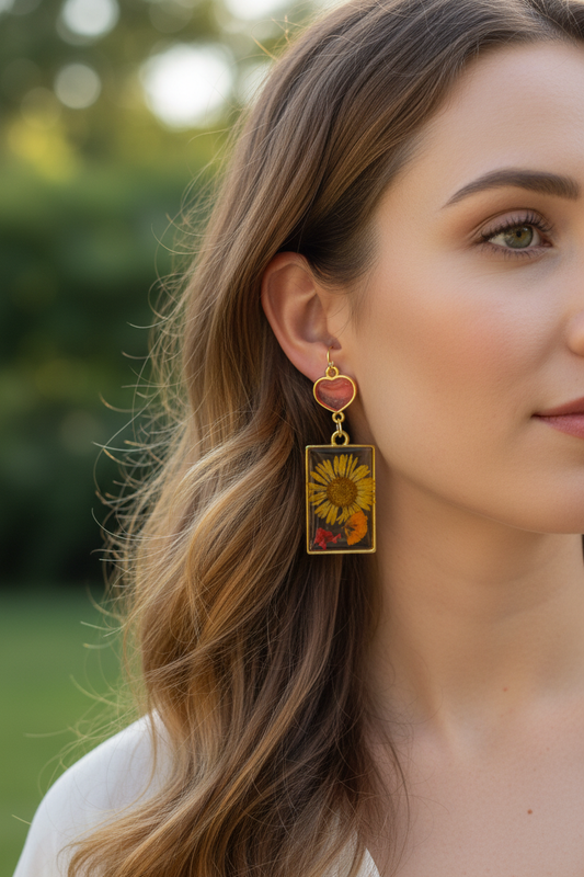 Sunflower pressed flower resin earrings on model